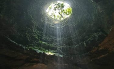 Discovering the Hidden Wonders of Jomblang Cave: A Journey Into the Unknown